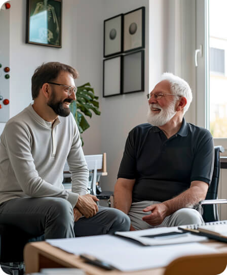 Two men having a discussion in an office setting.